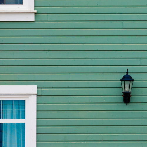 A Home With Green Siding.