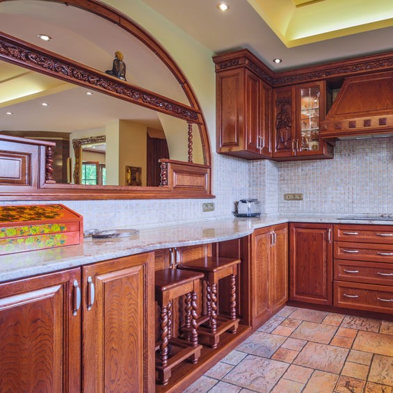 brown kitchen with marble counters