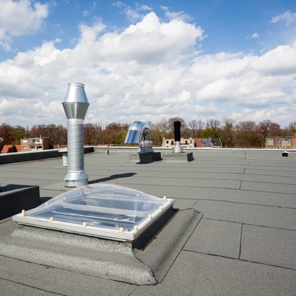 flat roof installed on roof with skylight